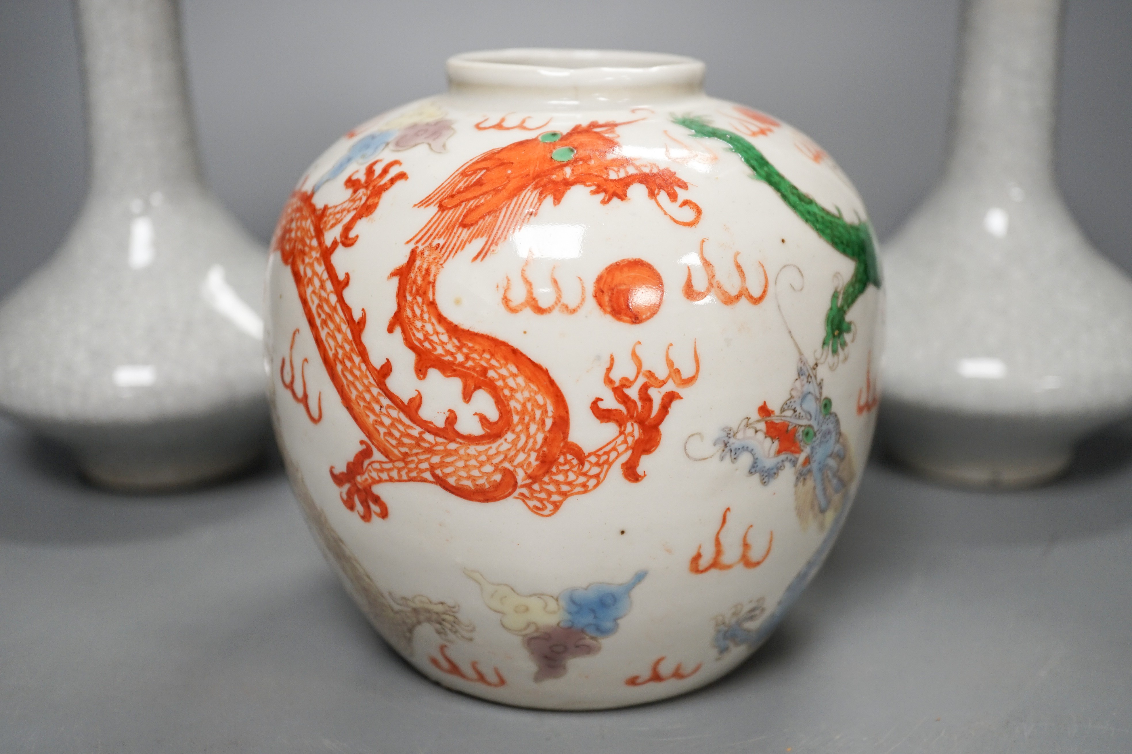 A Chinese enamelled porcelain 'dragon' jar and two crackleglaze bottle vases, tallest 19cm
